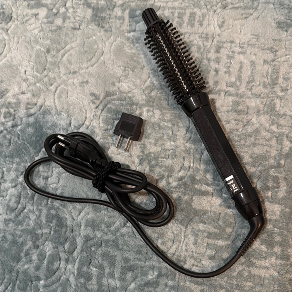 Black Hair Styling Brush with Cord. Dual voltage for US & overseas.